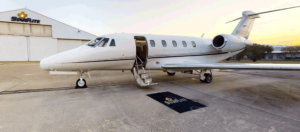 A small jet sitting on top of an airport runway.