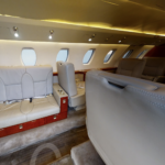 A small airplane with some seats and tables