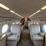 A large airplane with white seats and windows.