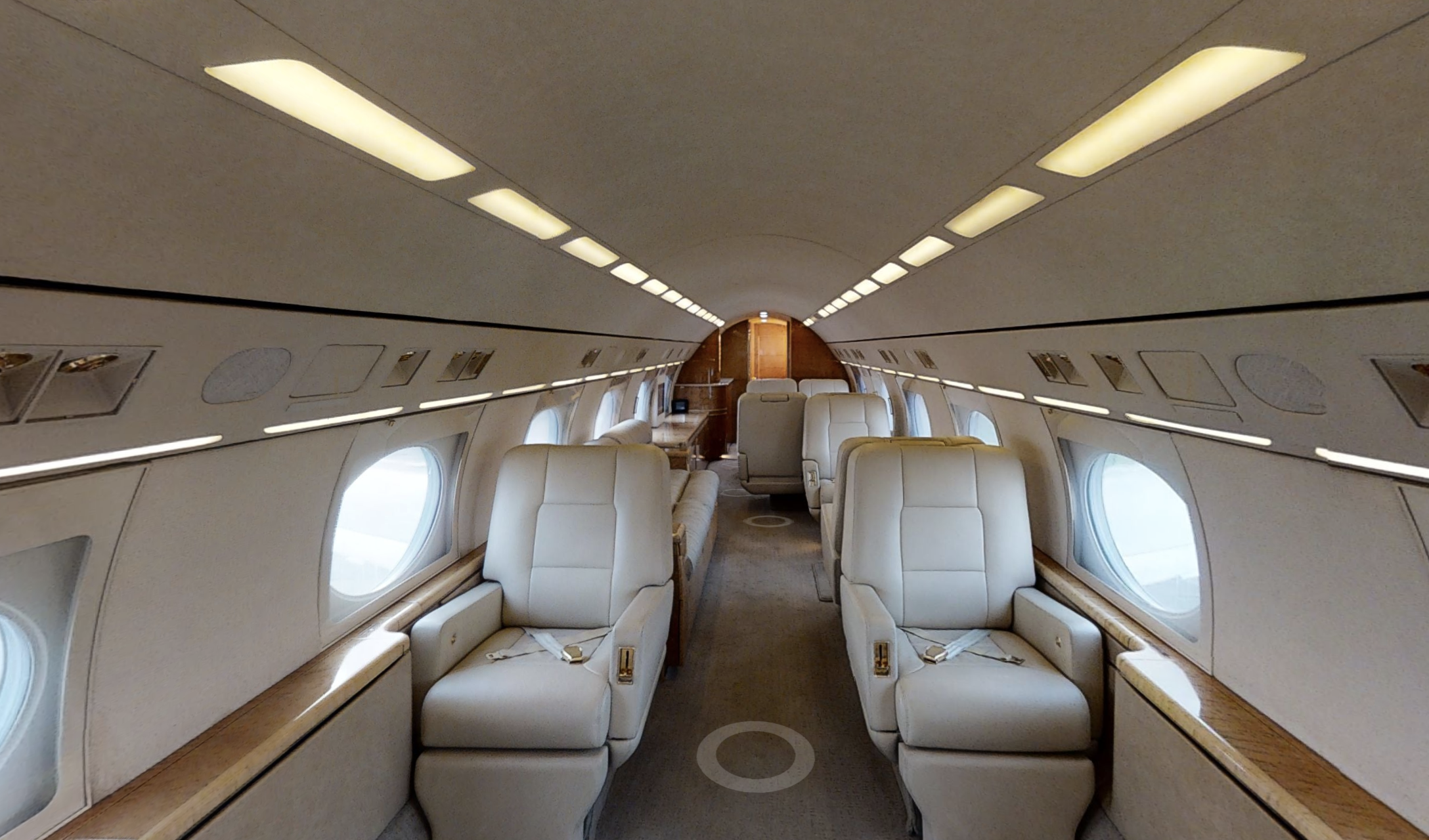 A large airplane with white seats and windows.