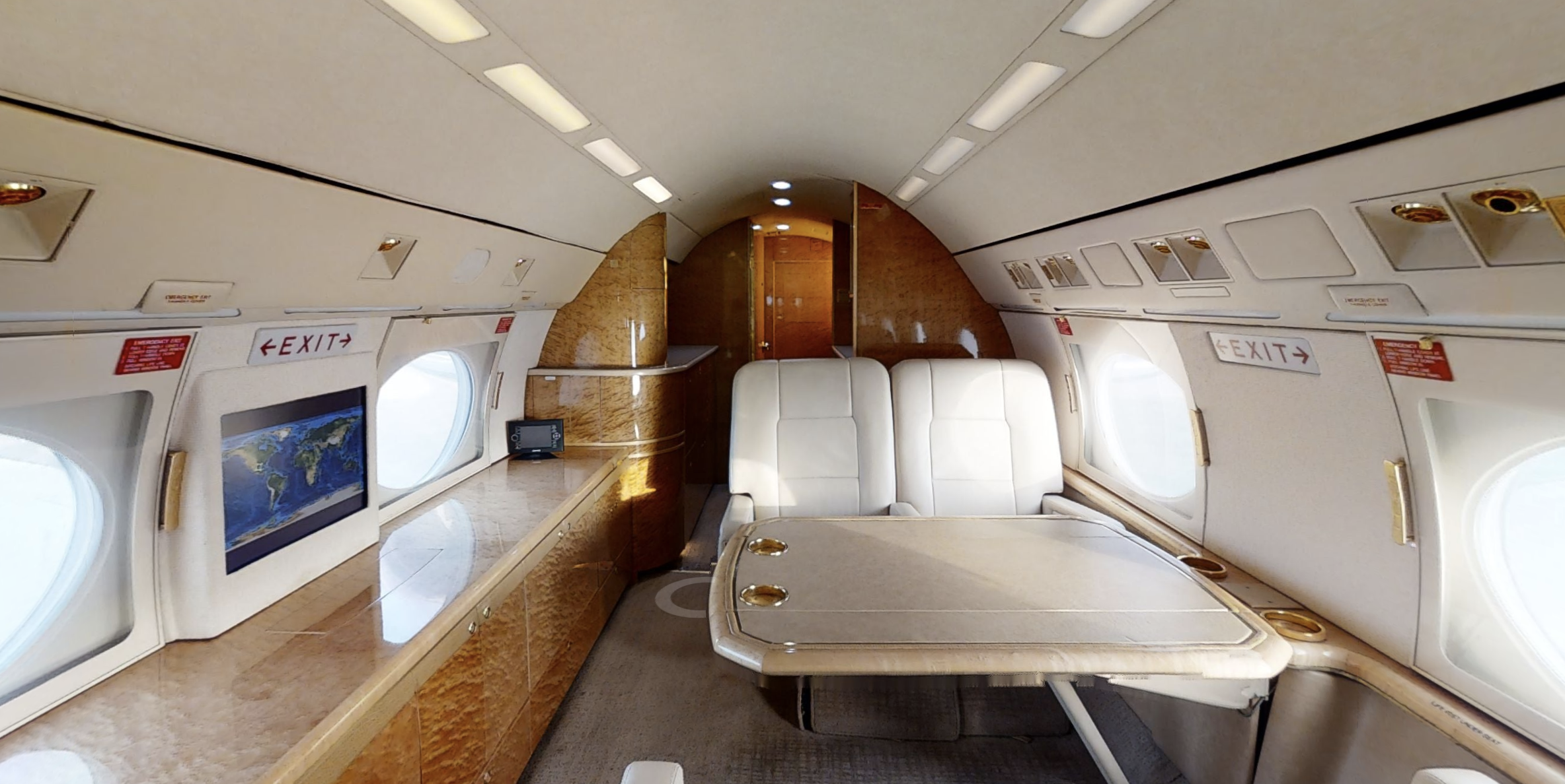 A small airplane with two beds in it.