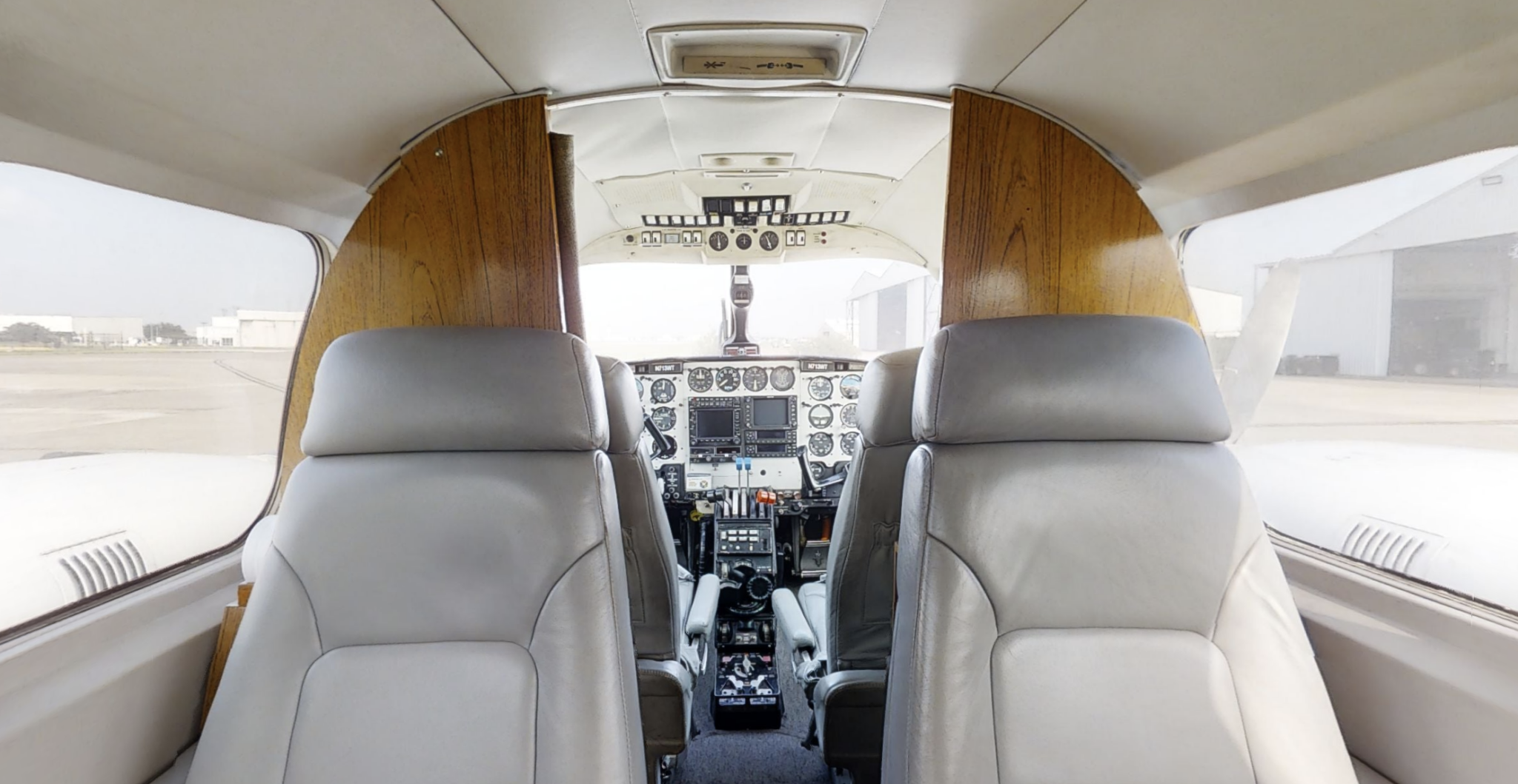 A view of the cockpit and controls in an airplane.