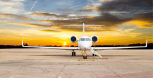A white airplane is parked on the runway